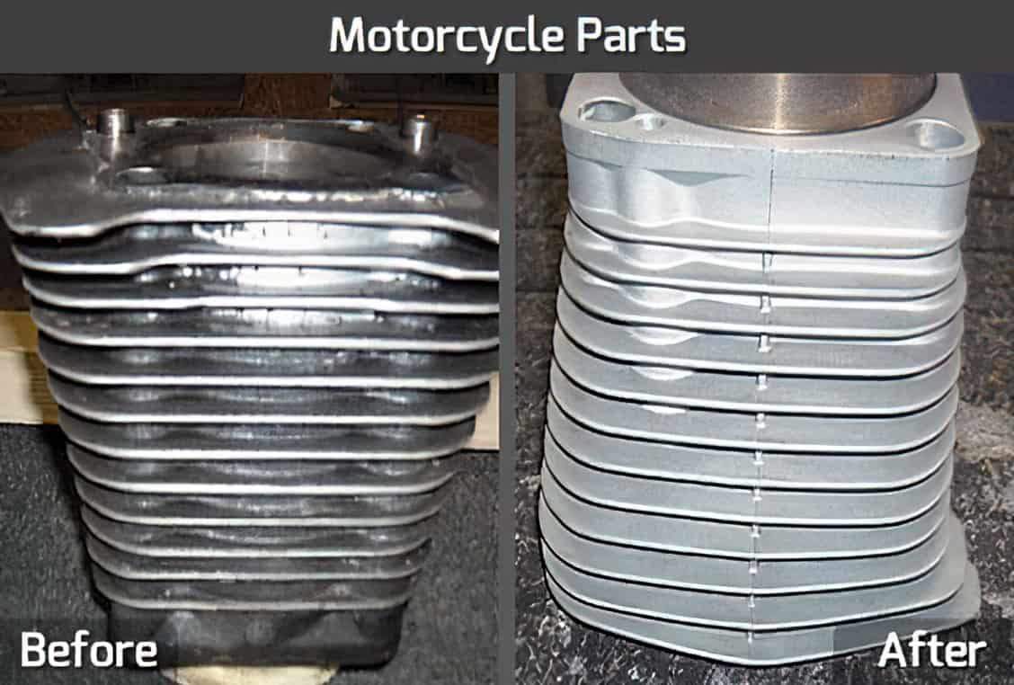 A before and after comparison of a motorcycle part, which is a cylinder with horizontal ridges. In the before image, the cylinder is dark and dirty, while in the after image, it is clean, polished, and has a shiny silver finish.